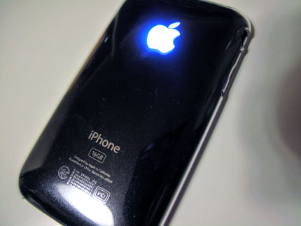 iPhone 3GS with an illuminating Apple Logo.